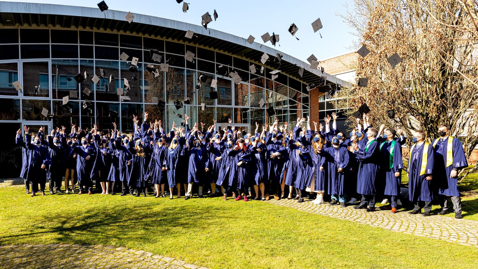 University graduates throw their hats