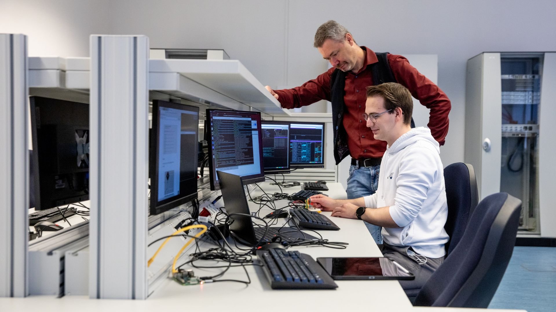 Computer science student together with lecturer