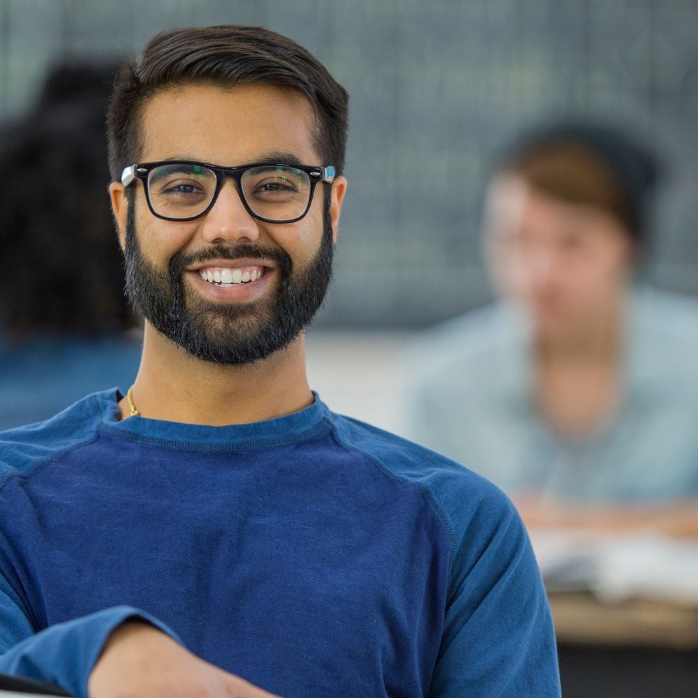 Smiling student with glasses