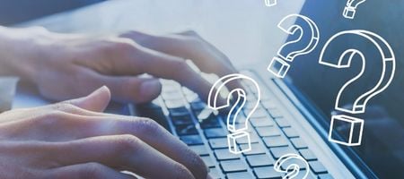 Laptop with question mark