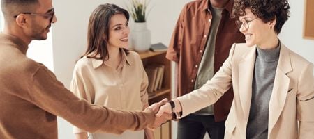 Man and woman shake hands