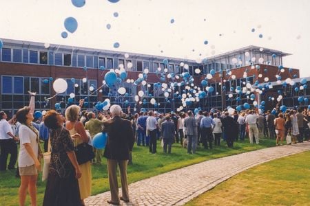 People with balloons on the campus grounds