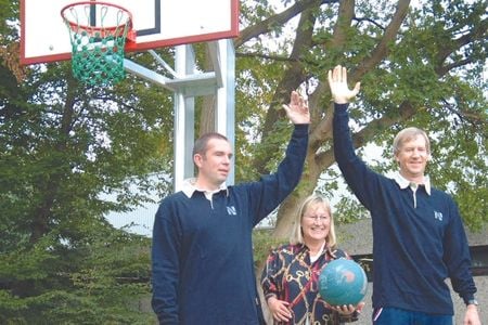 People standing in front of basketball hoop